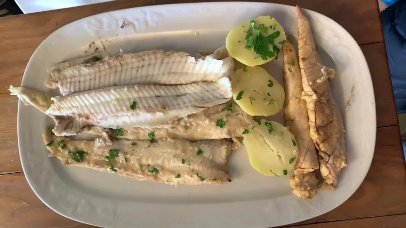 Fish fillets with boiled potatoes and parsley