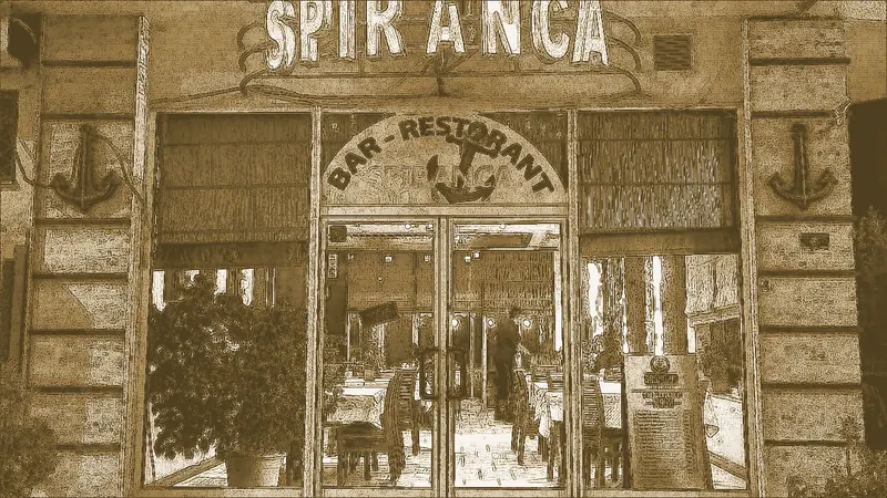The Spiranca entrance with its anchor emblems and neon sign, in brass tones